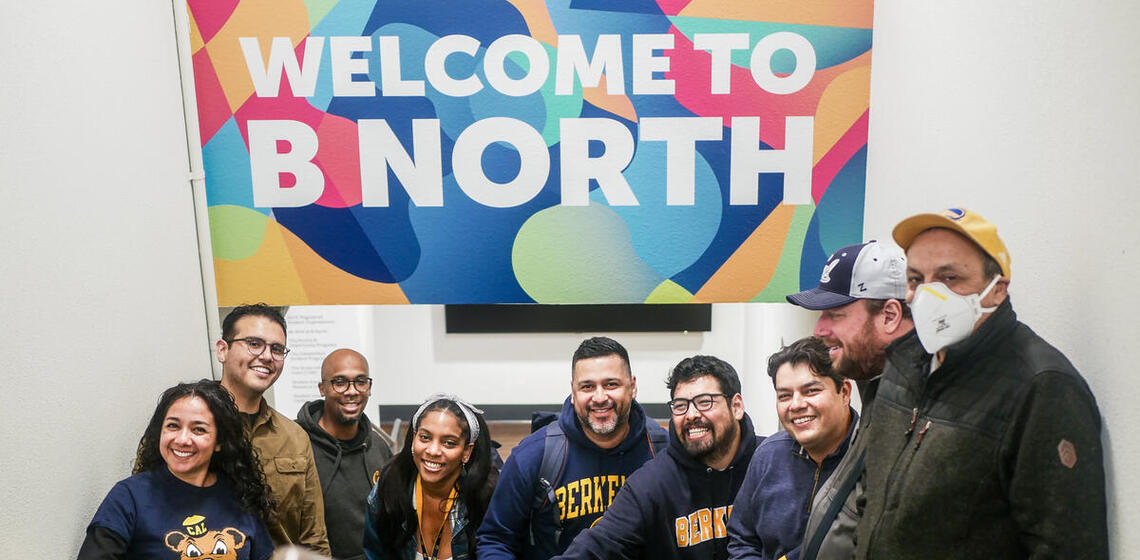 group of students posing in front of a sign reading "Welcome to B North"